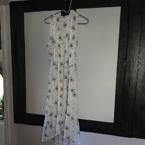 White Sleeveless Dress with Green Floral Pattern